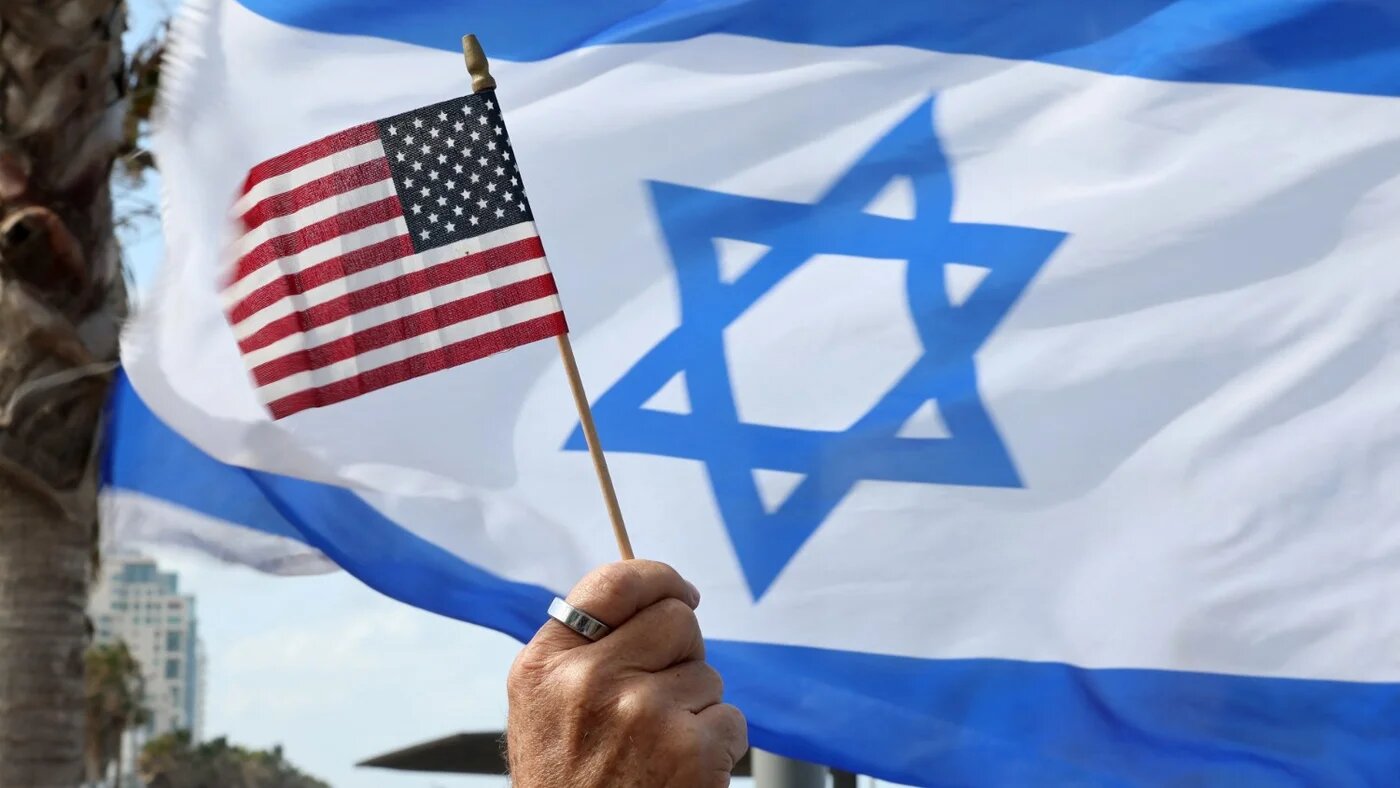 People demonstrate outside the US Embassy in Tel Aviv praising US president's comments over the Israeli government's controversial judicial reform bill on 30 March 2023.