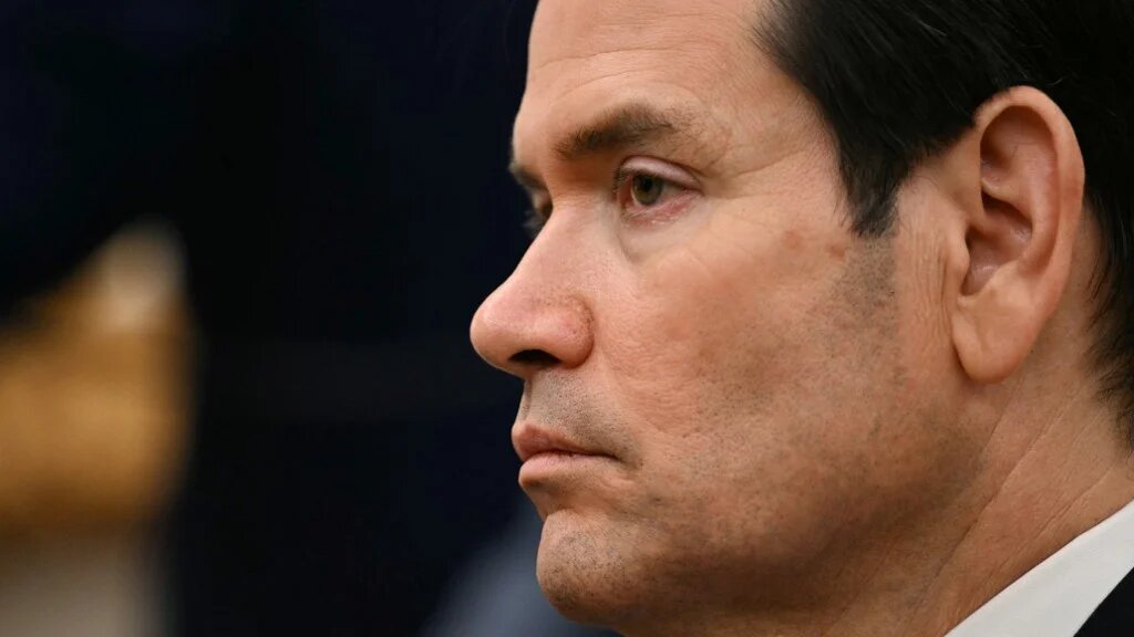 US Secretary of State Marco Rubio looks on as President Donald Trump meets Canadian Prime Minister Mark Carney at the White House in Washington, DC, on 7 October 2025 (Jim Watson/AFP)