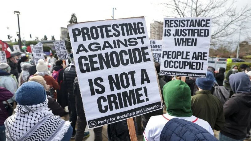People protest the arrest of activist Mahmoud Khalil at the University of Washington campus in Seattle, Washington, on 15 March 2025 (Jason Redmond/AFP)