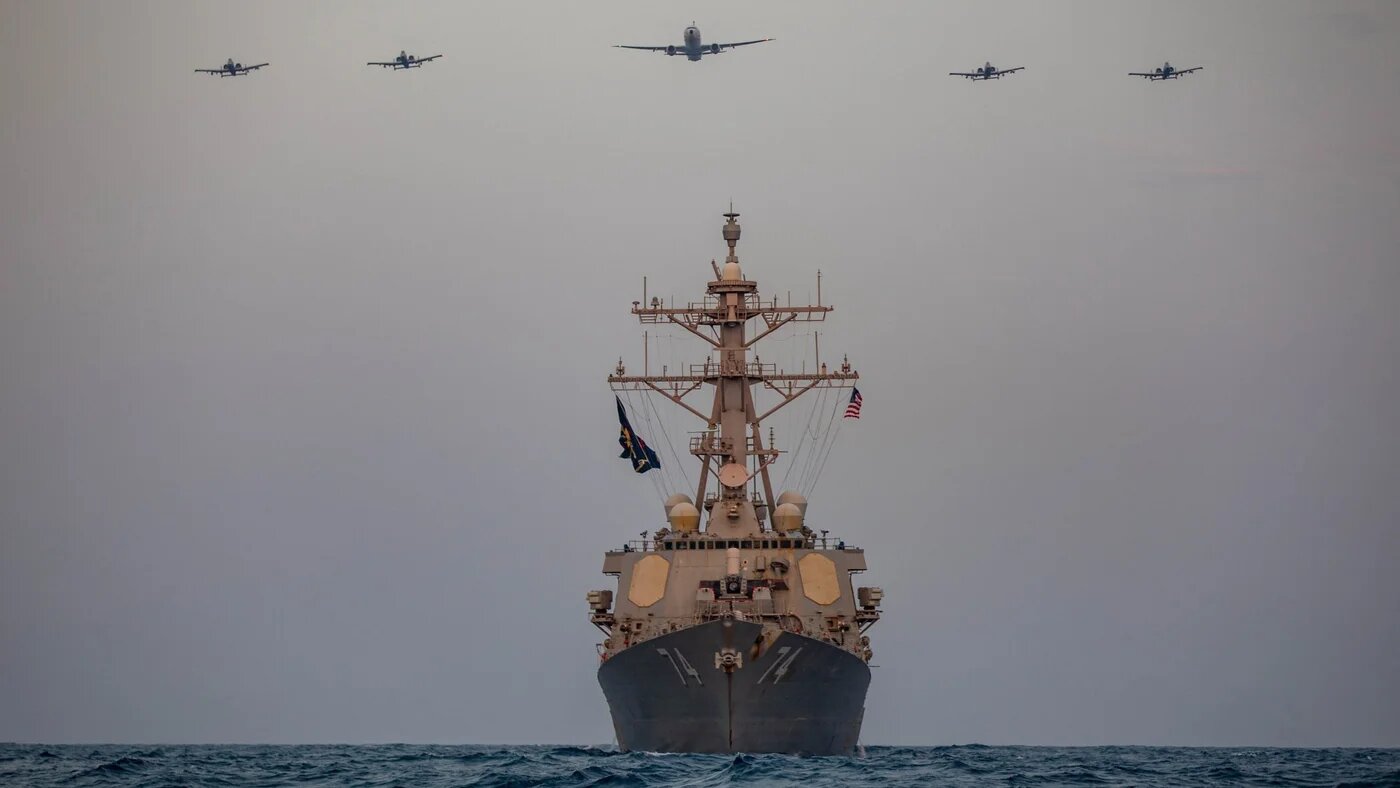 US Air Force A-10s fly over the USS McFaul during operations in the Gulf, on 15 August 2023 (AFP/US Central Command/Handout)