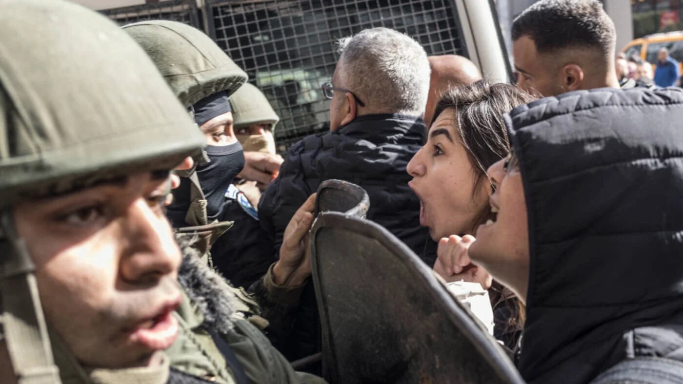 Demonstrators clash with Palestinian security forces in Ramallah, West Bank, in January 2024 (AFP)
