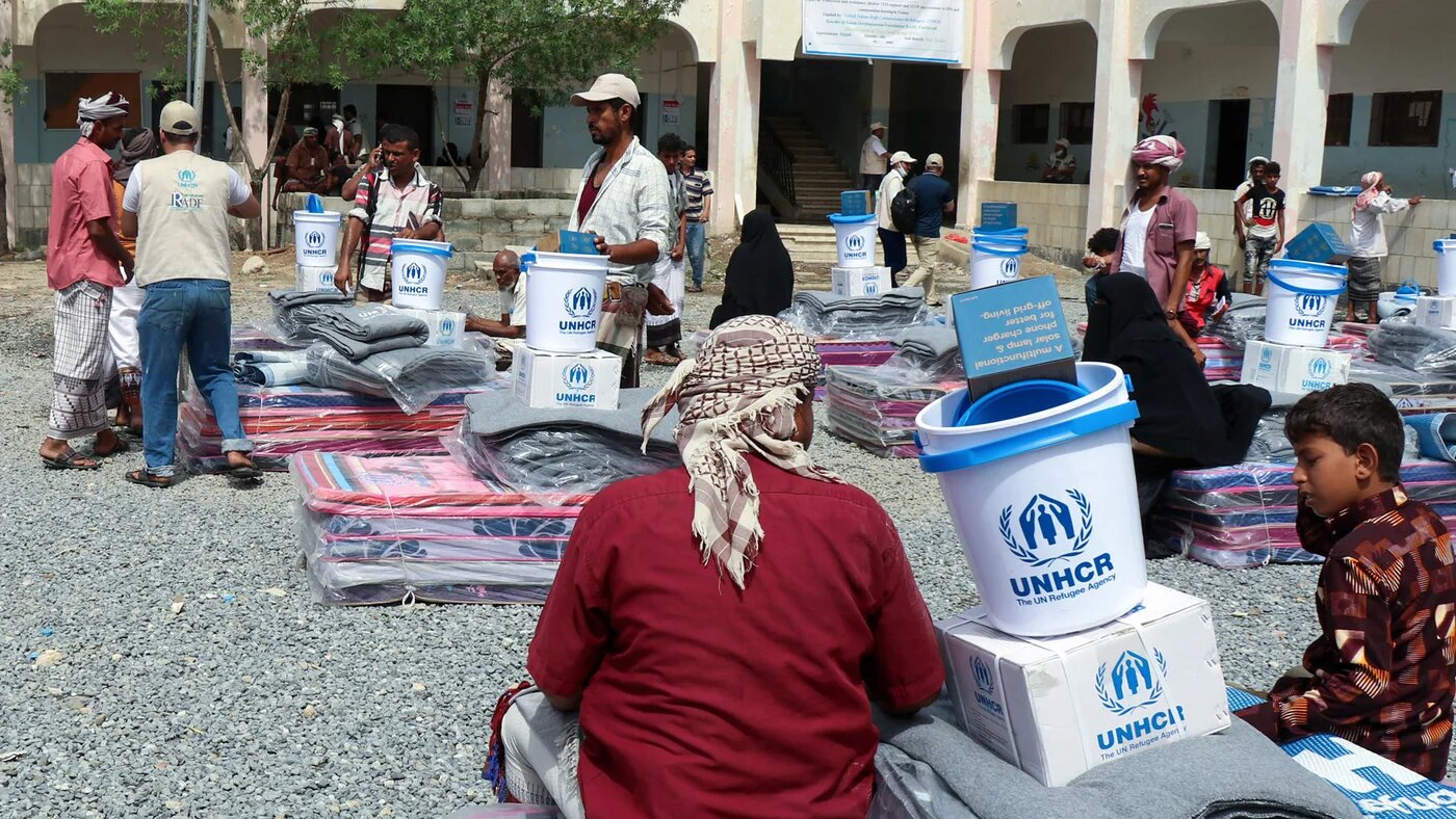 Displaced Yemenis receive humanitarian aid provided by the UN High Commissioner for Refugees in the northwestern province of Hajjah on 1 August 2021.
