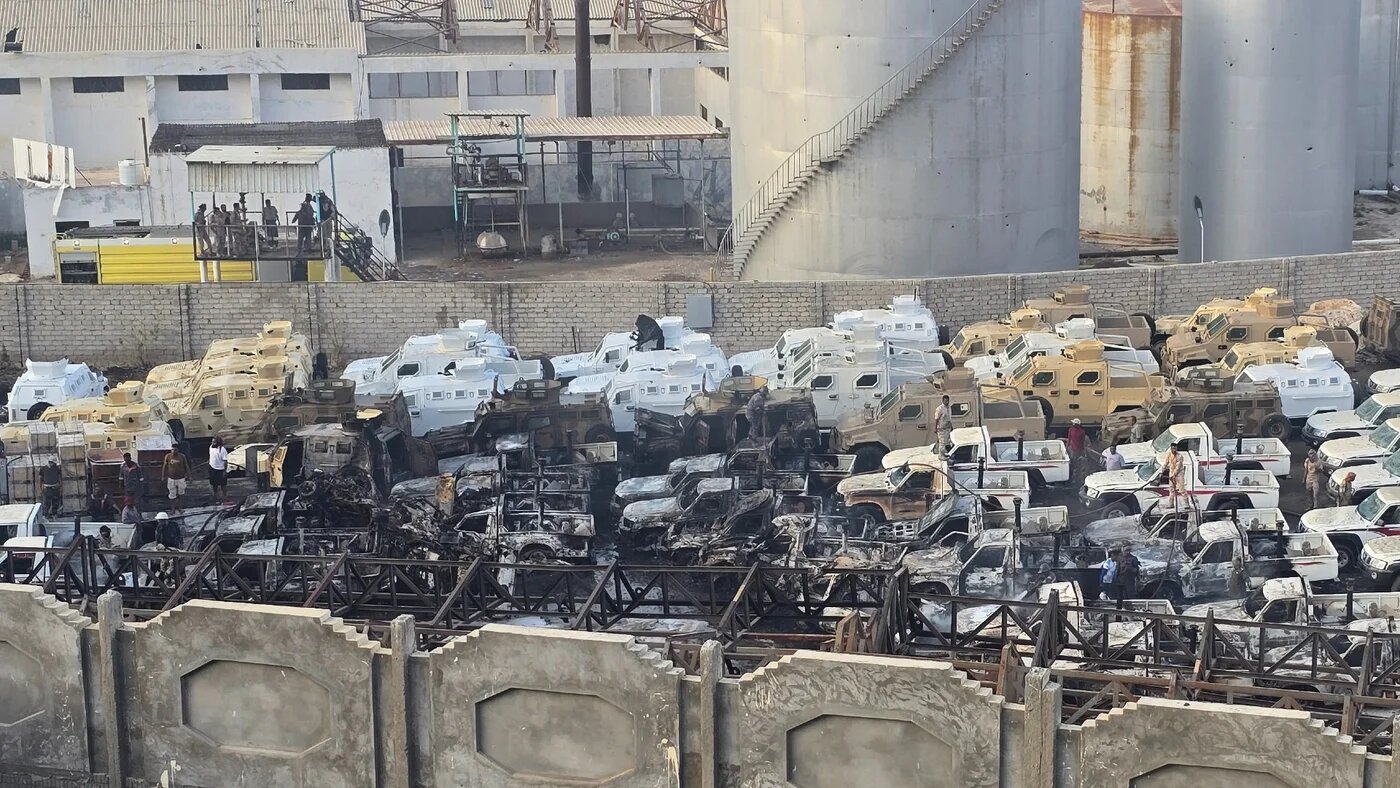 Damaged military vehicles, reportedly sent by the UAE to support the Southern Transitional Council, following an air strike carried out by the Saudi-led coalition in the port of Mukalla, southern Yemen, on 30 December 2025 (AFP/Stringer)