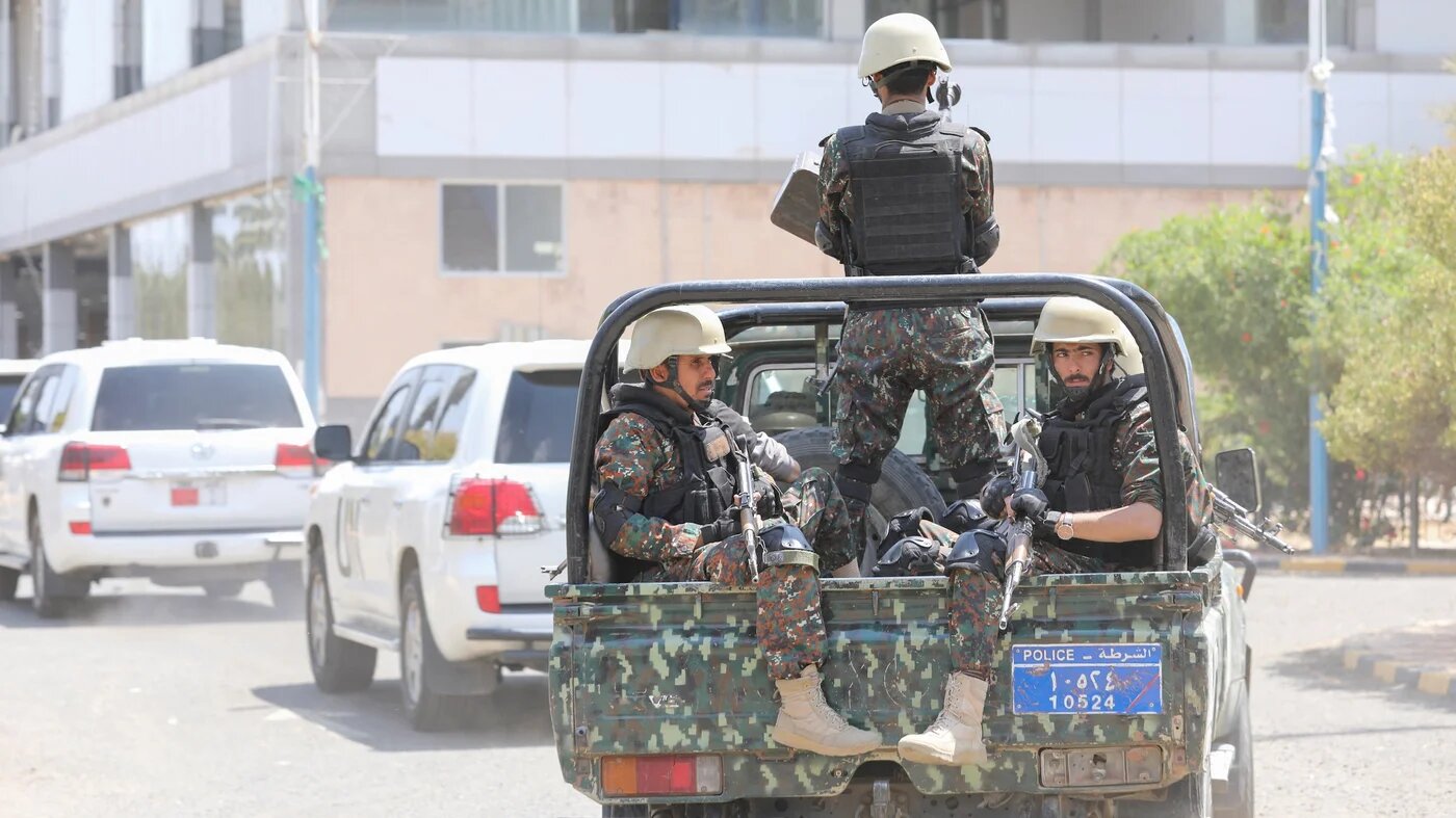 Houthi police troopers escort the convoy of the United Nations envoy for Yemen, Hans Grundberg, as it leaves Sanaa Airport, Yemen, 11 April 2022 (Reuters)