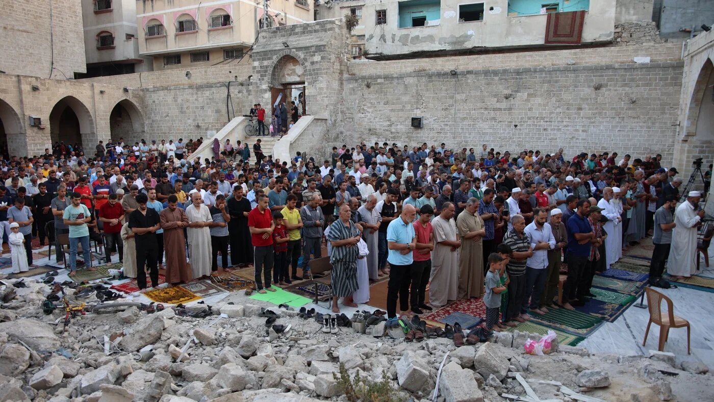Palestinians perform Eid al-Adha prayers in the bombed-out ruins of Gaza City's historic Omari Mosque on 16 June 2024 (Omar al-Qattaa/AFP)
