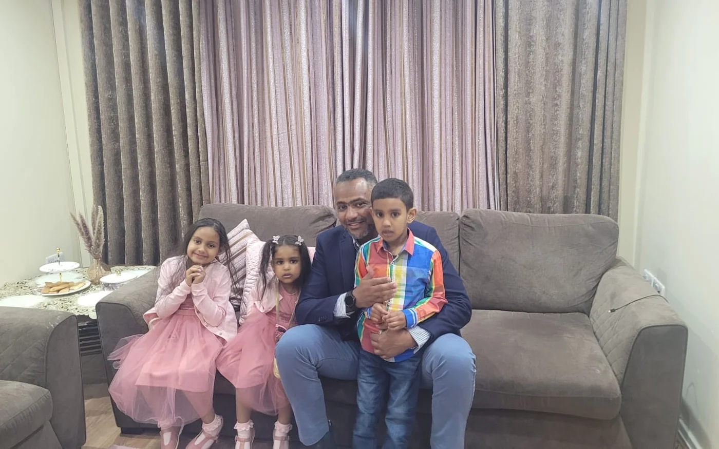 Ahmed Doush and his three children