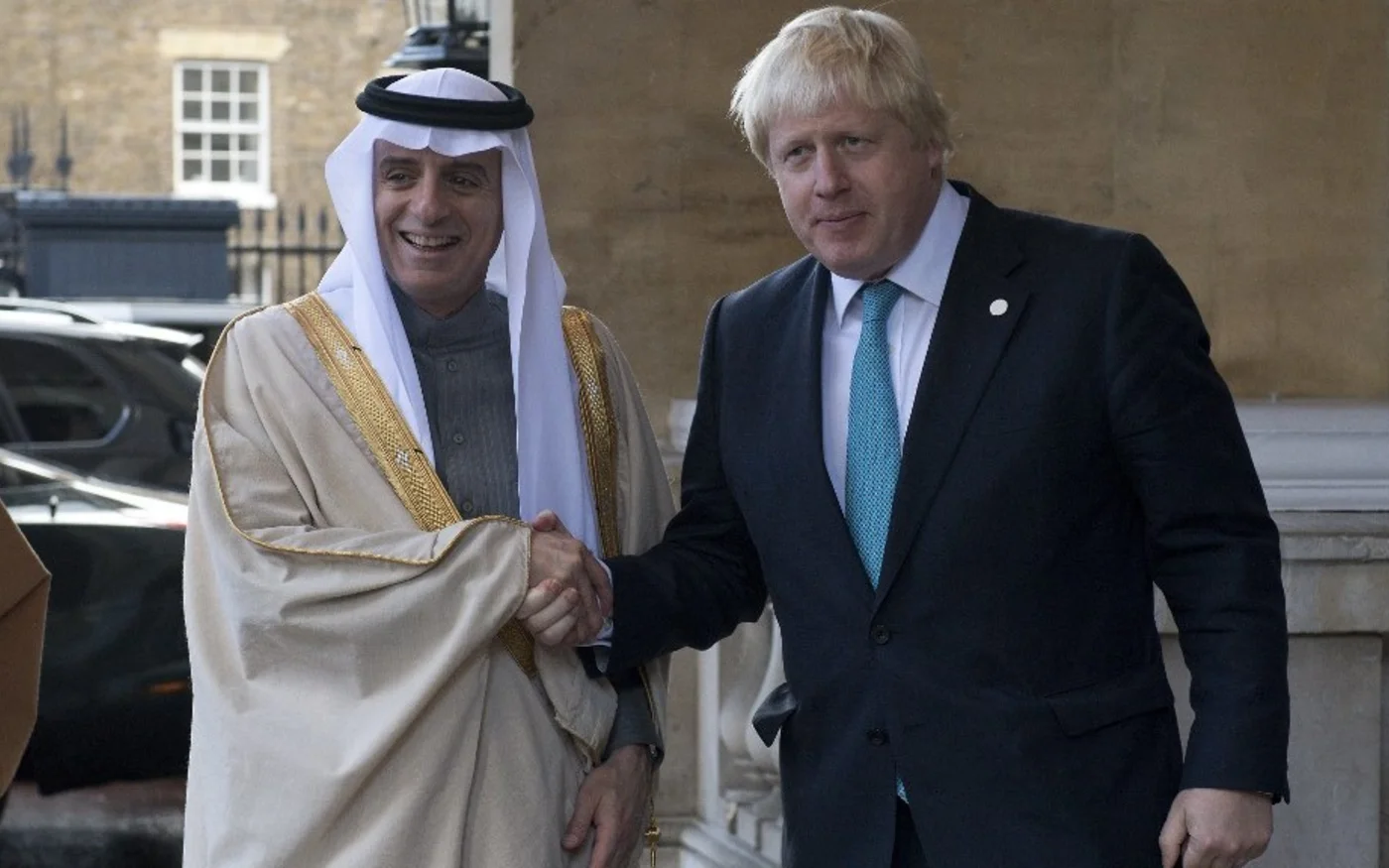 Then British Foreign Secretary Boris Johnson greets then Saudi Foreign Minister Adel al-Jubeir in London on 16 October 2016, just over a week after the Great Hall attack (Justin Tallis/AFP)