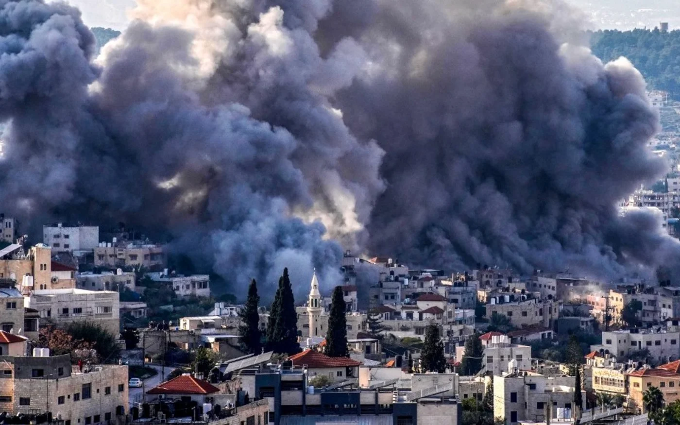 Smoke billows from the Jenin refugee camp after an Israeli raid on 2 February 2025 (Mohammad Mansour/AFP) 
