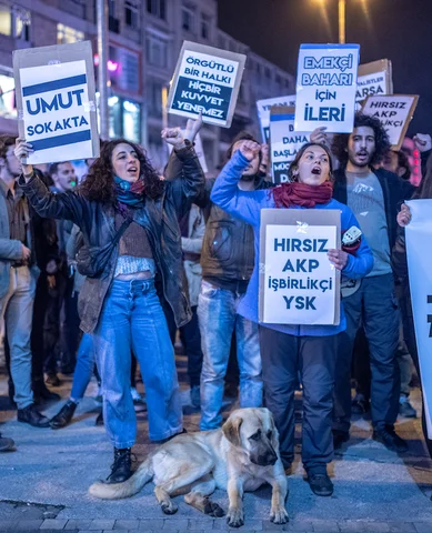 Protesters hold placards and chant slogans during a demonstration in Istanbul, on 8 May 2019 (AFP)