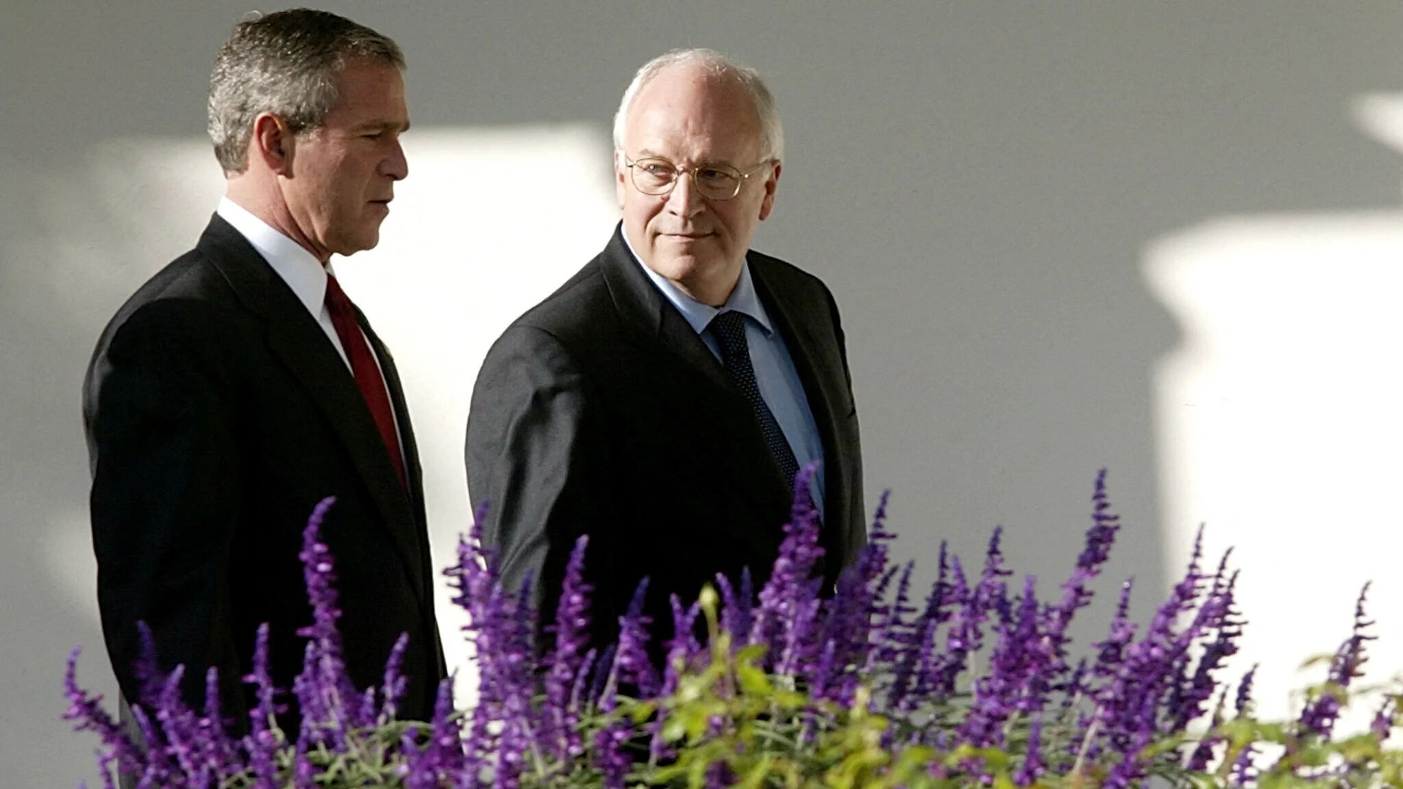 Dick Cheney, one of the most powerful vice presidents in US history, walks with President George W Bush along the White House colonnade in Washington, DC, on 29 October 2003, during the catastrophic wars on Afghanistan and Iraq, more than two decades before his death on 3 November 2025 at the age of 84 (Stephen Jaffe/AFP)