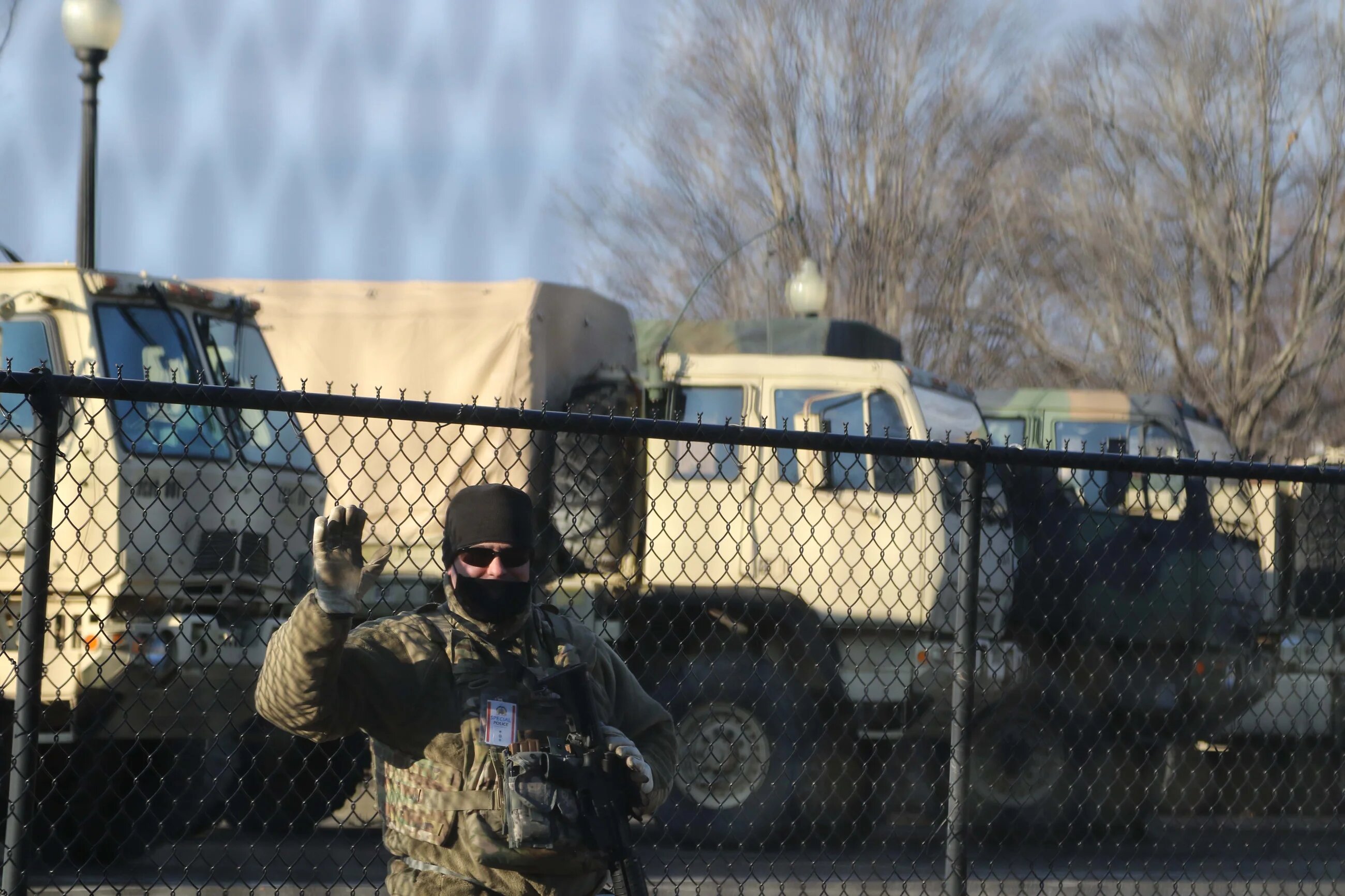 A US soldier waves while on guard duty