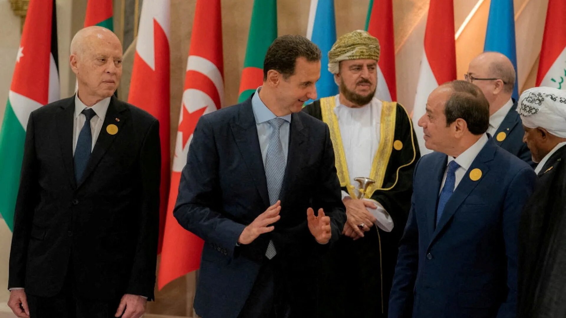 Tunisia's President Kais Saied (L) looks on as Syrian President Bashar al-Assad (C) chats with Egypt's President Abdel Fattah el-Sisi at an Arab League summit in Jeddah, 19 May 2023 (Saudi Press Agency via Reuters)