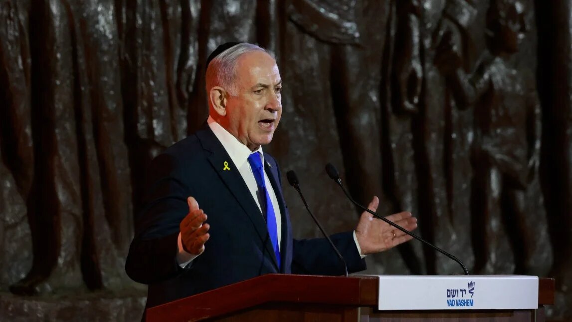 Israeli Prime Minister Benjamin Netanyahu speaks during a ceremony marking Holocaust Remembrance Day in Jerusalem on 23 April 2025 (Menahem Kahana/AFP)
