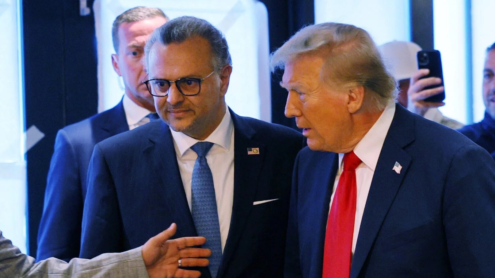 Then-Republican presidential nominee Donald Trump is joined by his daughter's Lebanese father-in-law, Massad Boulos, during a campaign stop at the Great Commoner restaurant in the majority-Arab city of Dearborn, Michigan, on 1 November 2024 (Brian Snyder/Reuters)