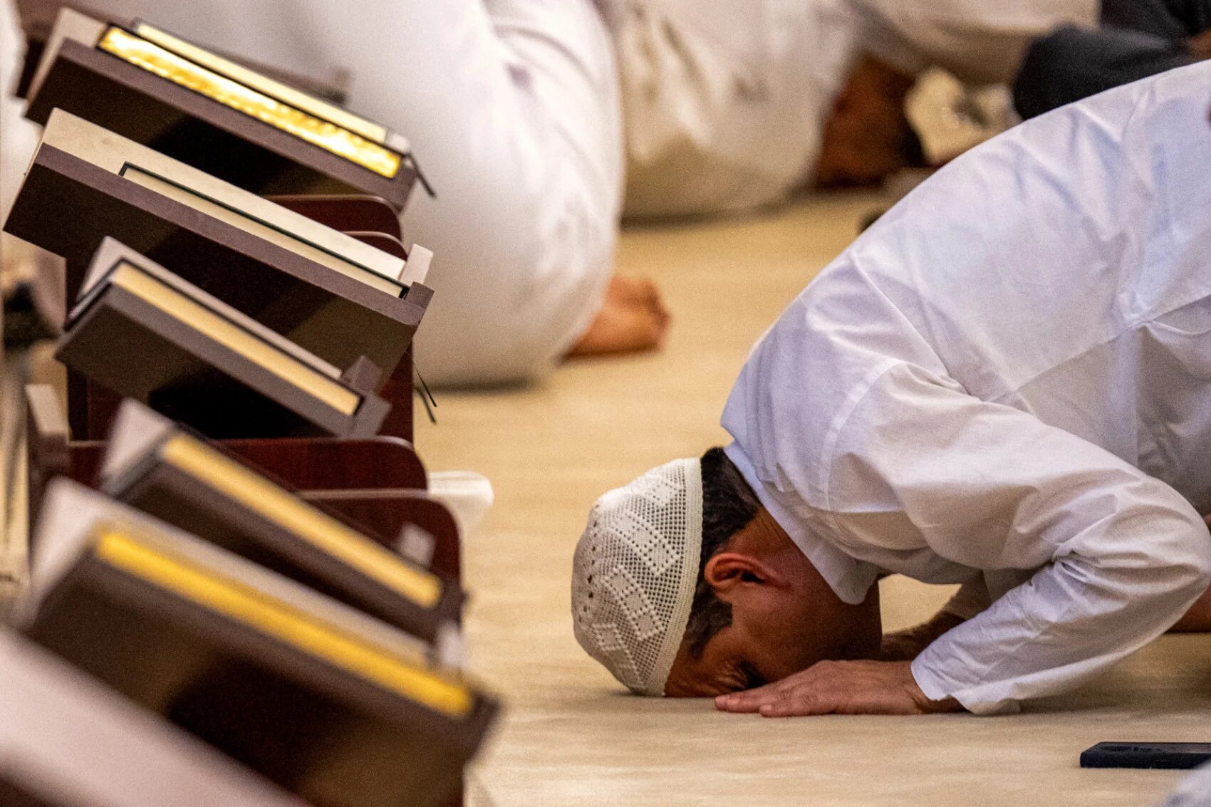 A Muslim devotee attends the morning prayers celebrating the holiday of Eid al-Fitr, marking the end of the holy month of Ramadan, at the Mary Mother of Jesus Mosque in Abu Dhabi early on 20 March 2026 (Ryan Lim / AFP)