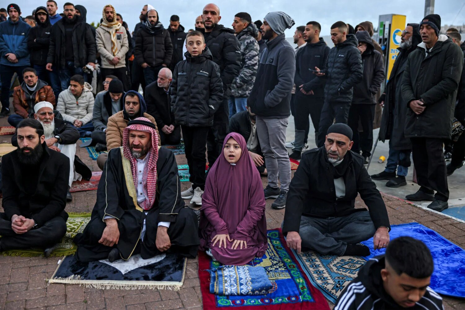 Muslim worshippers gather outside Jerusalem's Old City walls for morning prayers