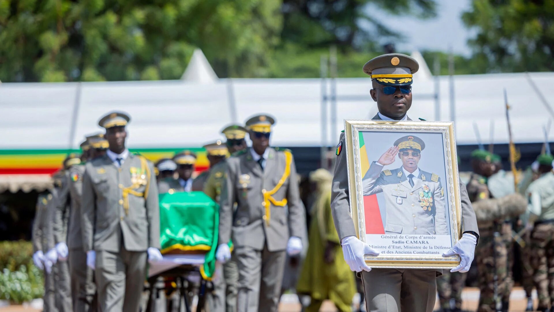 A framed portrait and the coffin of Malian Defence Minister Sadio Camara are displayed during his state funeral in Bamako, Mali, 30 April 2026 (Mali Presidency/Reuters)