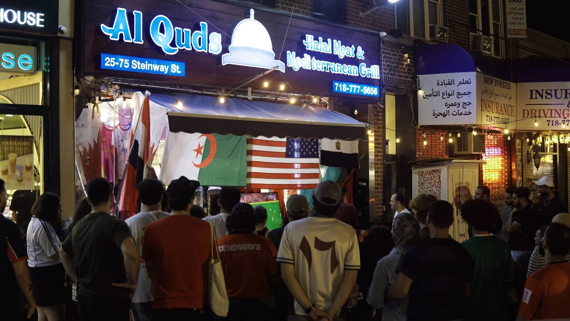 Some frocers in Astoria turned their storefronts into impromptu World Cup watch parties, drawing fans onto the streets (Azad Essa/MEE)