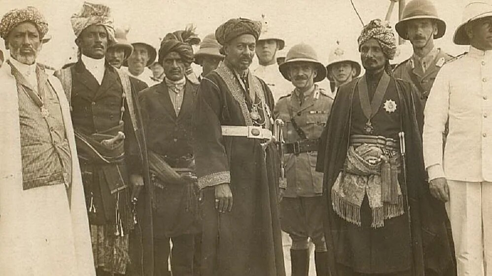 Rulers of the states of the Aden Protectorate with British navy and army officers aboard a British warship, probably at the end of World War I. (Wikimedia Commons)