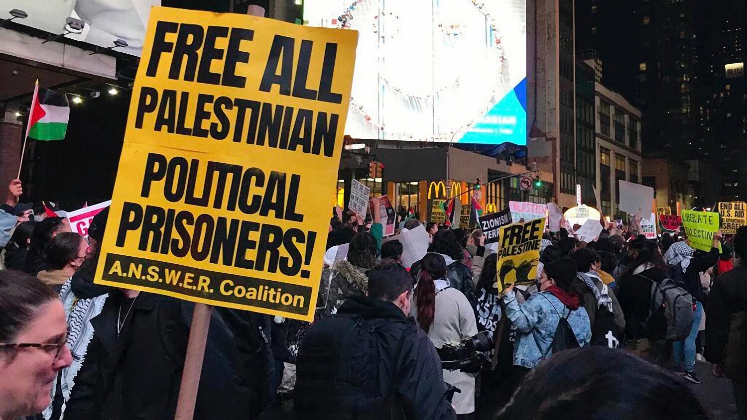 Pro-Palestinian demonstrators protest outside of The New York Times headquarters for its coverage of the Israel-Palestine war in New York on 9 November 2023 (AP)