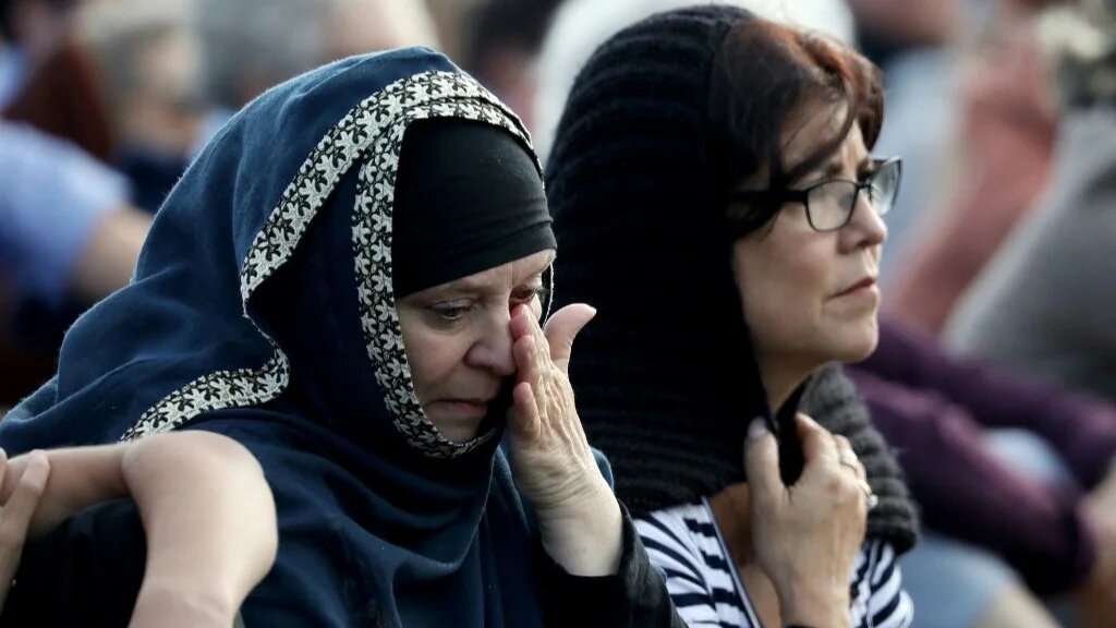Members of the Muslim community attend the National Remembrance Service at North Hagley Park in Christchurch, New Zealand on March 29, 2019 (AFP)