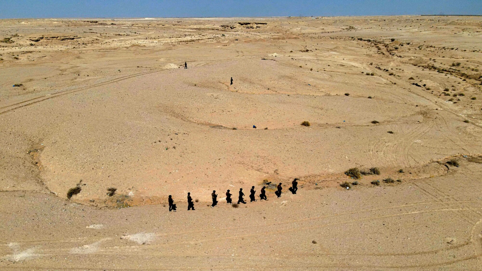 Iraqi forces take part in a security operation searching for infiltrators west of the central city of Najaf, in the desert stretching to the Saudi border, on 22 February 2026 (Ali Najafi/AFP)