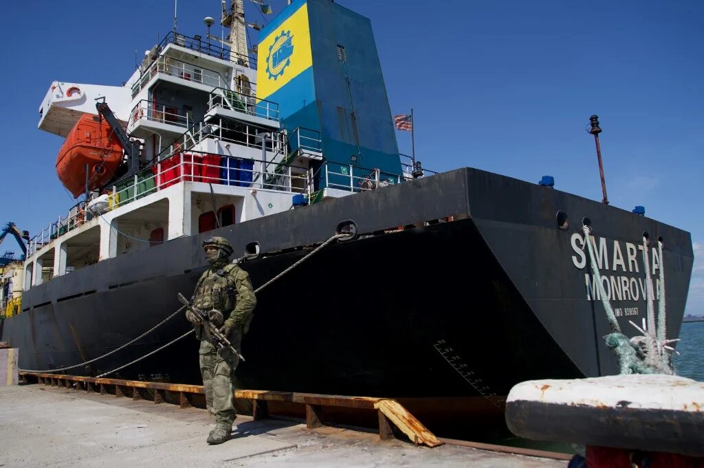 A Russian serviceman stands guard in the port of Mariupol on 29 April 2022, amid the ongoing Russian military action in Ukraine. (AFP)