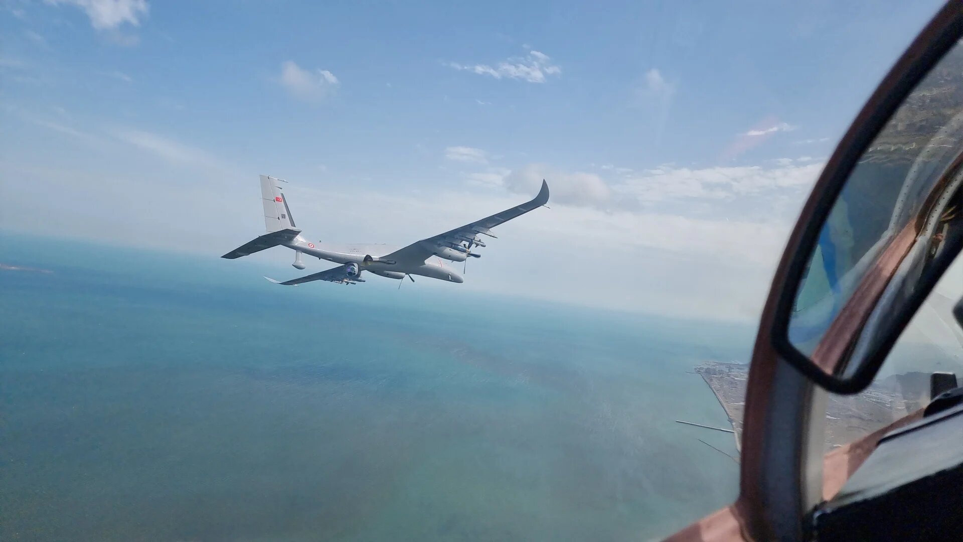 A Turkish Akinci combat drone developed by Baykar as it flies over Baku in 2022 (AFP)