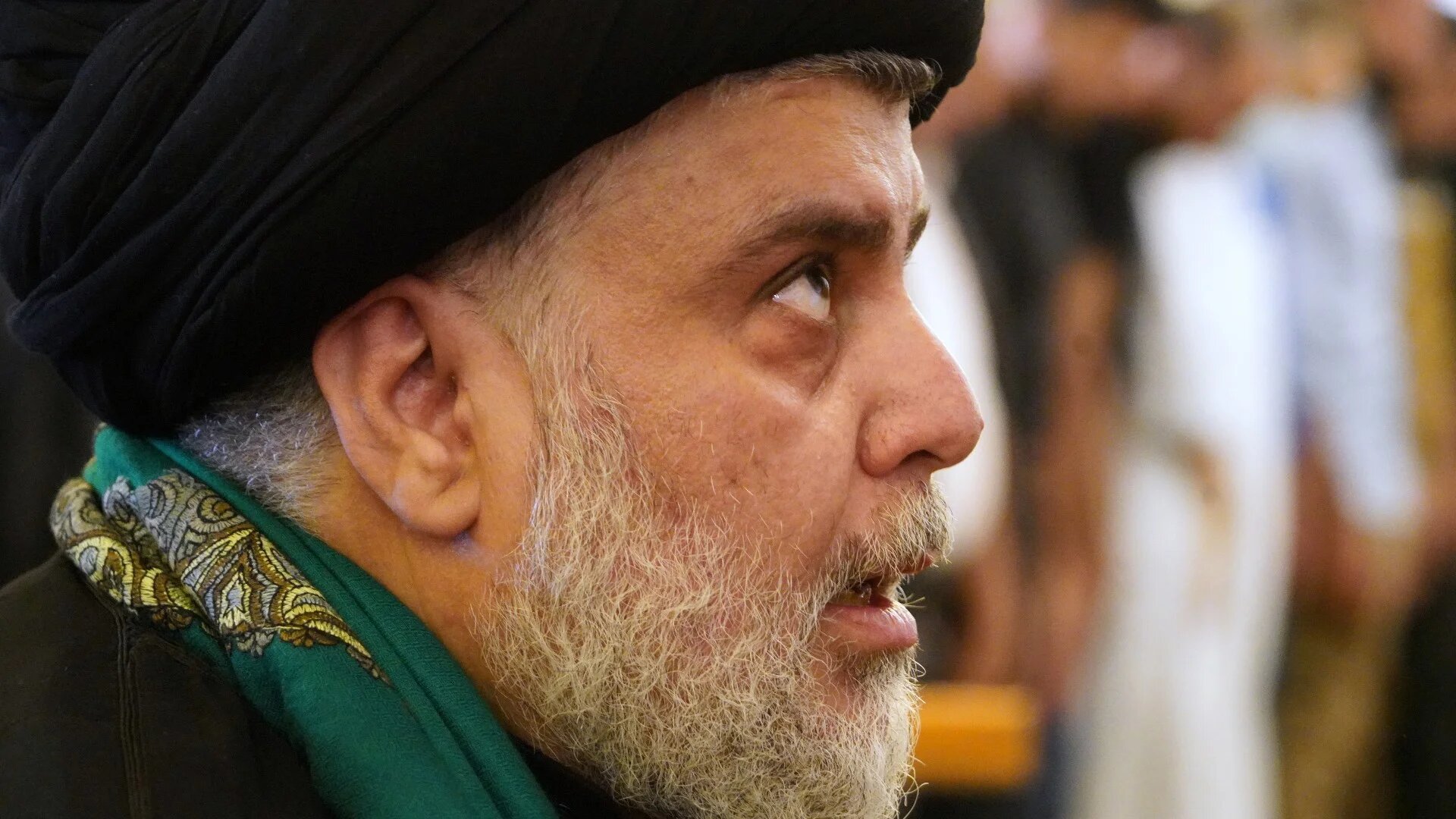 Muqtada al-Sadr leads Friday prayers alongside his supporters at the Great Mosque of Kufa outside the central holy city of Najaf, on 4 November, 2022 (AFP)