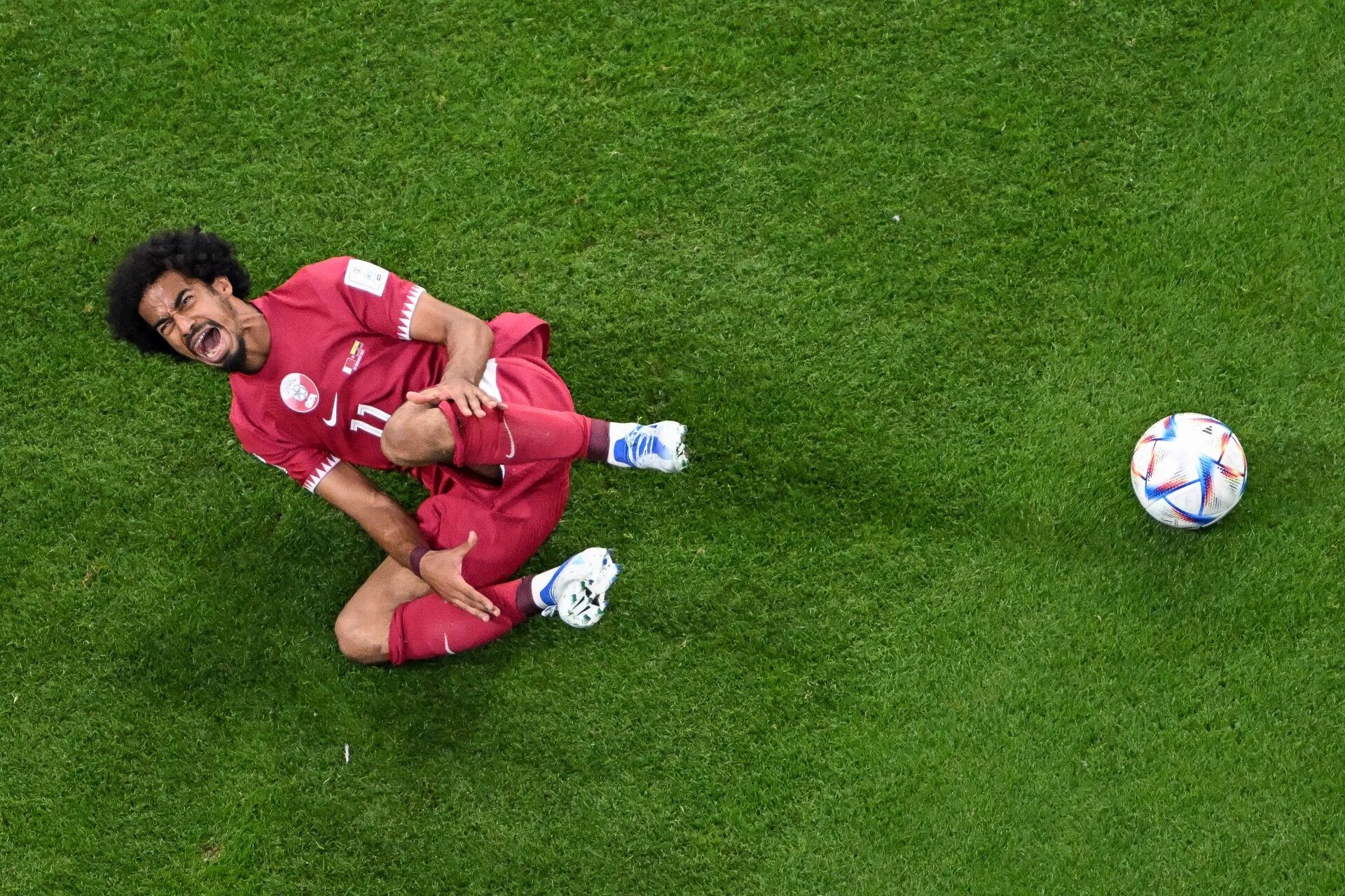 Qatar's Akram Afif gestures during the Group A football match between Qatar and Ecuador at the Al-Bayt Stadium (AFP)