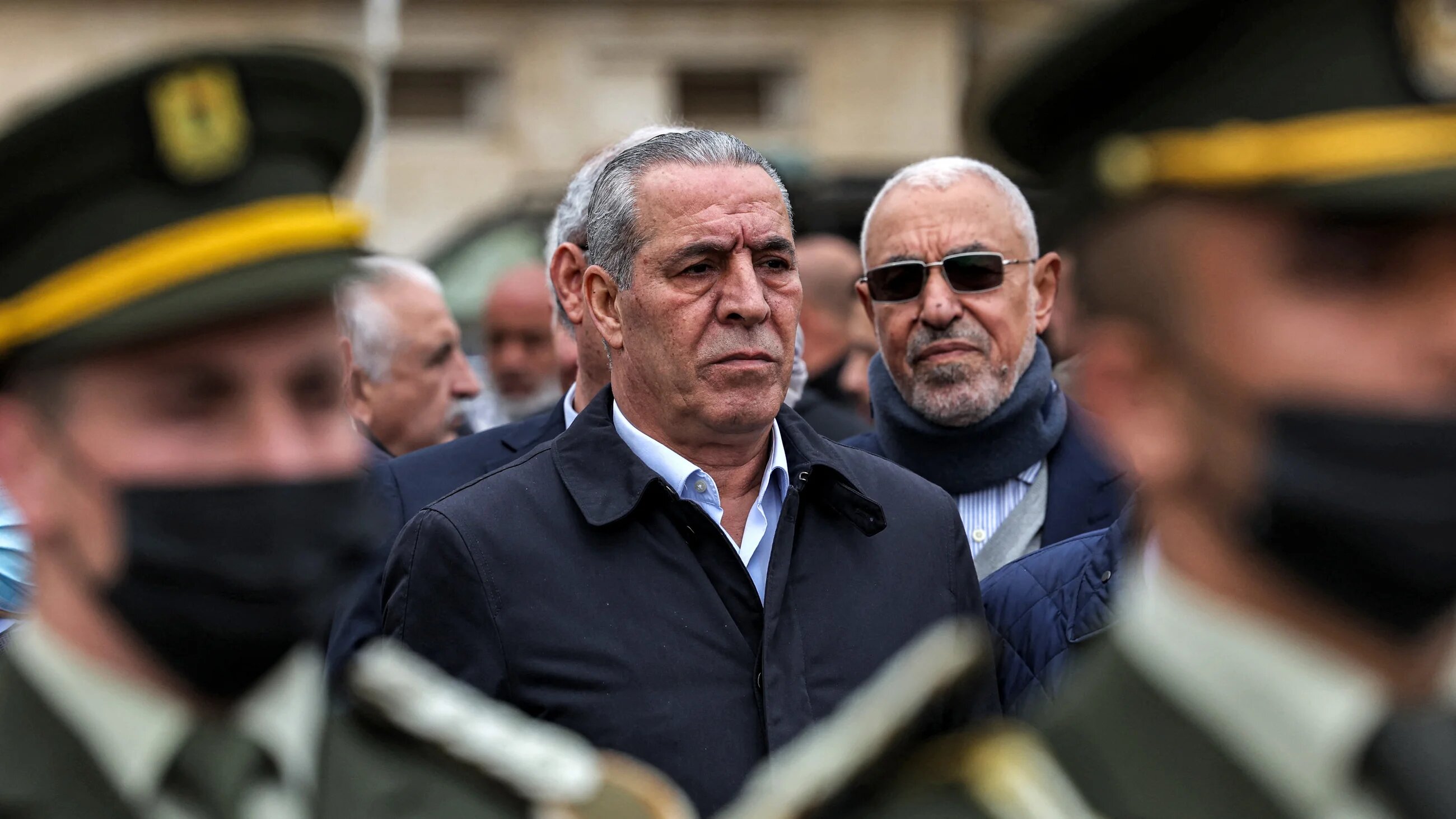 Hussein al-Sheikh attends the funeral of late Palestinian prime minister Ahmad Qorei in the occupied West Bank city of Ramallah on 22 February 2023 (AFP)