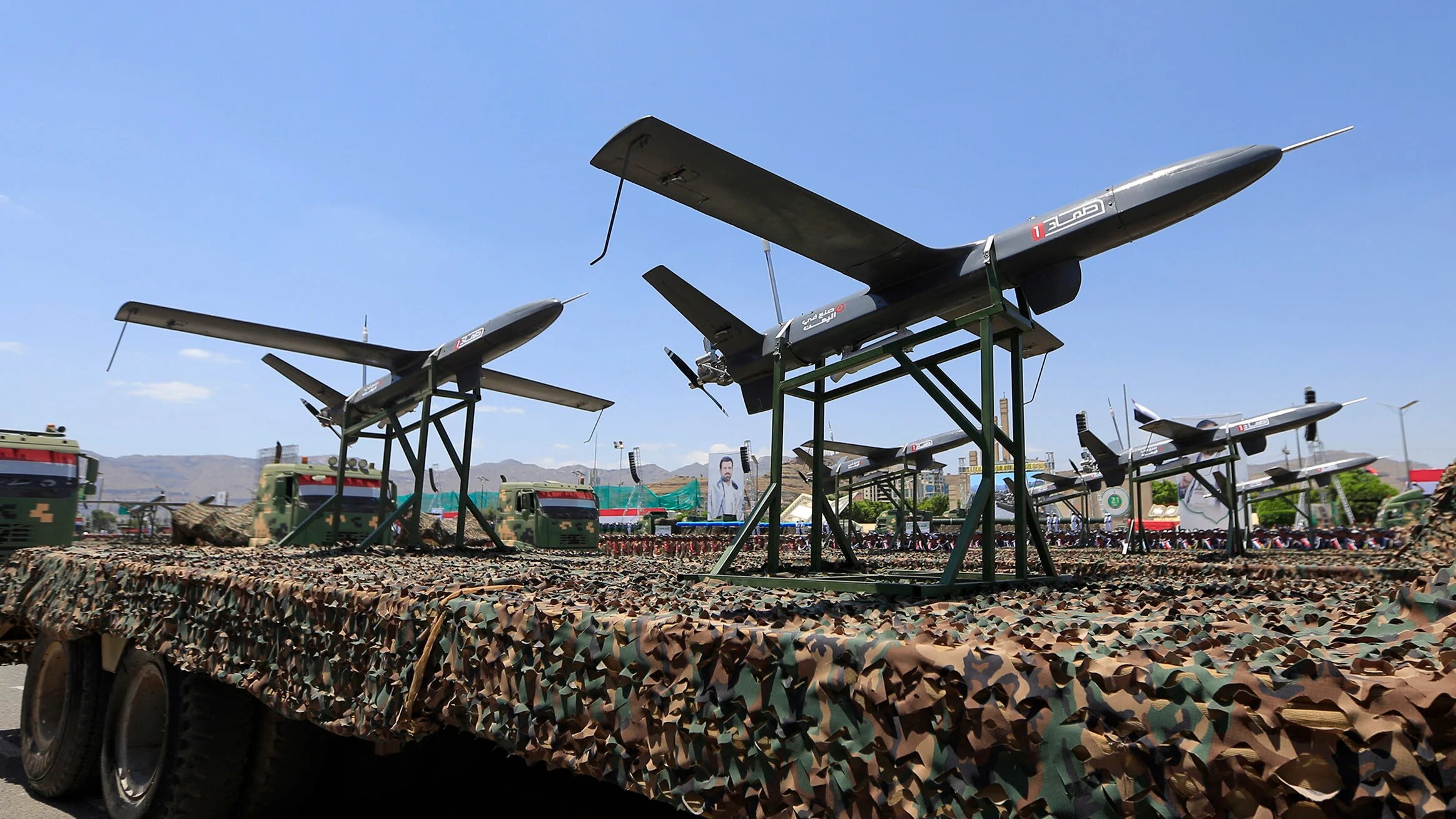 Drones are displayed on the back of a vehicle during an official military parade marking the ninth anniversary of the Houthi takeover of the capital Sanaa on 21 September 2023 (AFP)