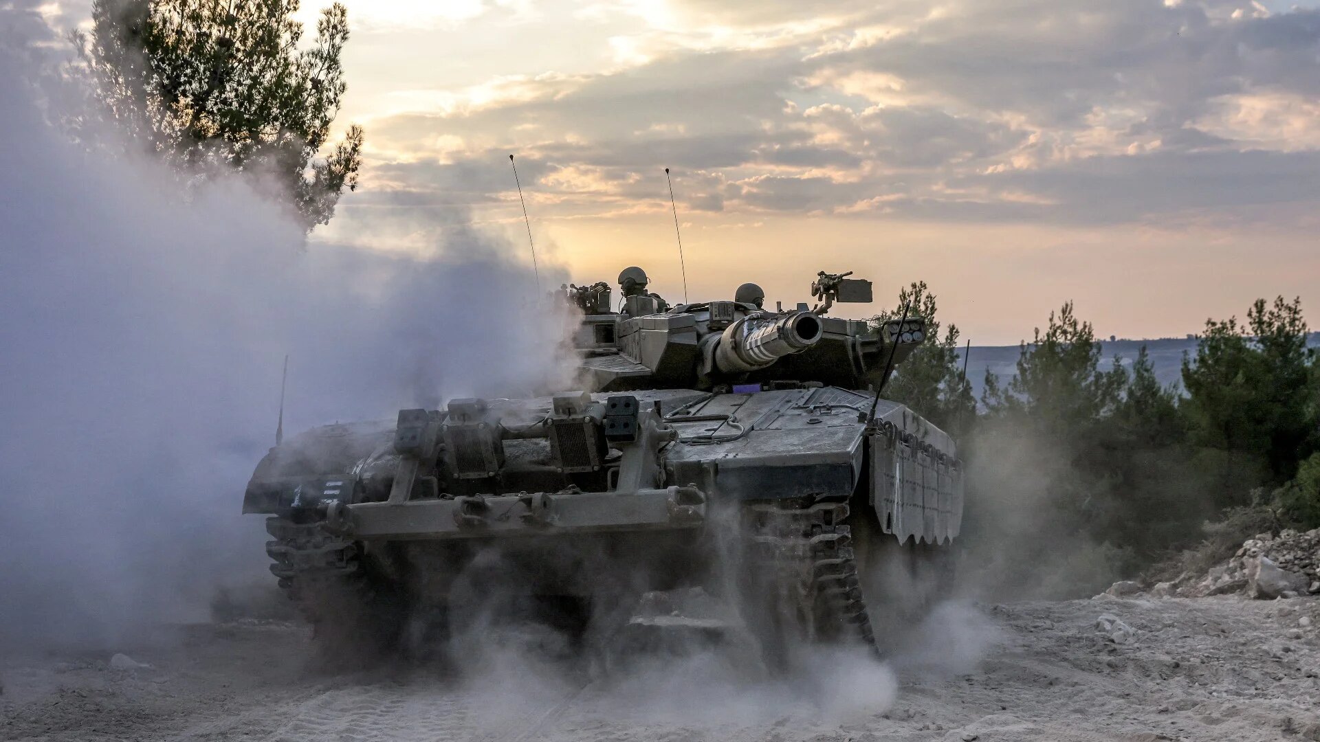 An Israeli army battle tank moves at a position in the upper Galilee region of northern Israel near the border with Lebanon on 1 November (AFP)