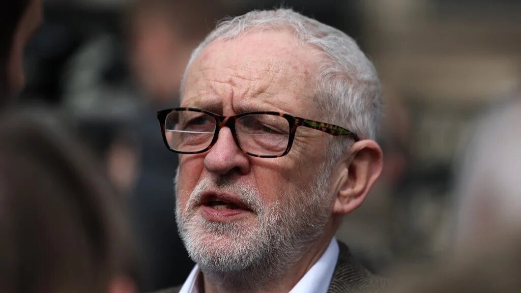 Former Labour Party leader Jeremy Corbyn joins supporters of WikiLeaks founder Julian Assange outside the Royal Courts of Justice in central London on 26 March 2024 (AFP)