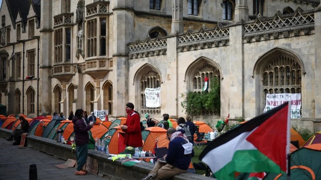 Students protest in support of Palestinians, at King's College, Cambridge University, on 7 May 2024 (AFP)