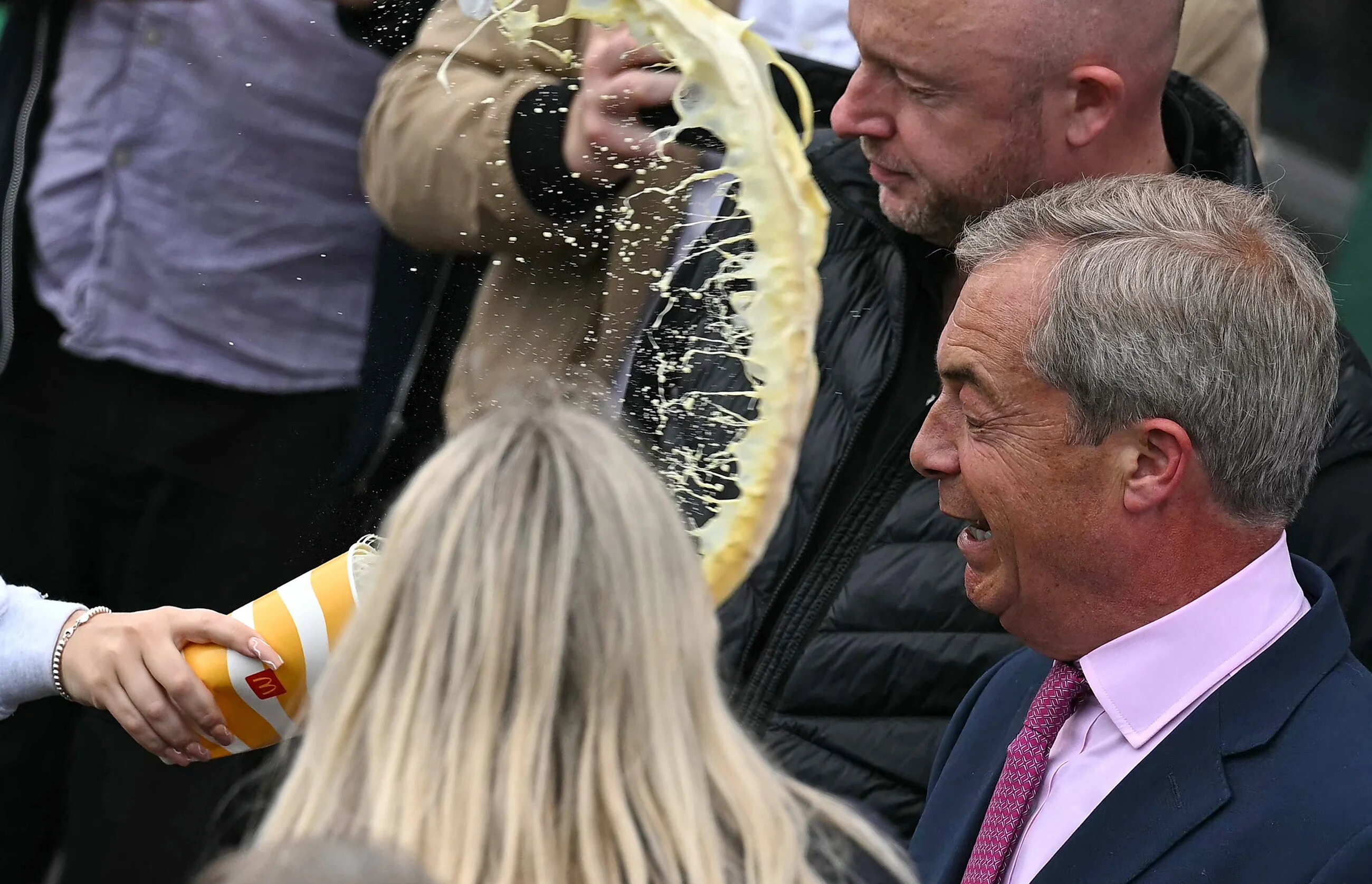 A milkshake is thrown at Nigel Farage after his campaign launch (AFP/Ben Stansall)