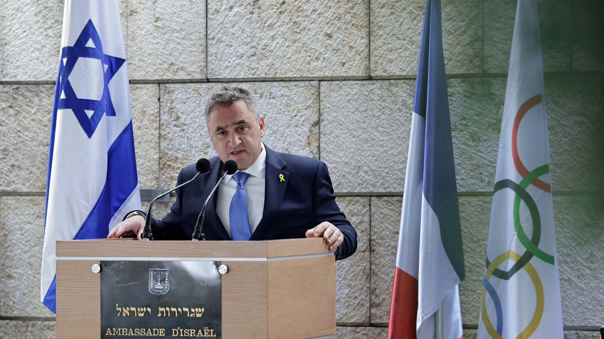 Israel's Ambassador to France Joshua Zarka  speaks during a ceremony to pay tribute to Israel's Olympic team victims in the Munich 1972 Games, at the Embassy of Israel in Paris on 6 August 2024 (Stephane De Sakutin/AFP)