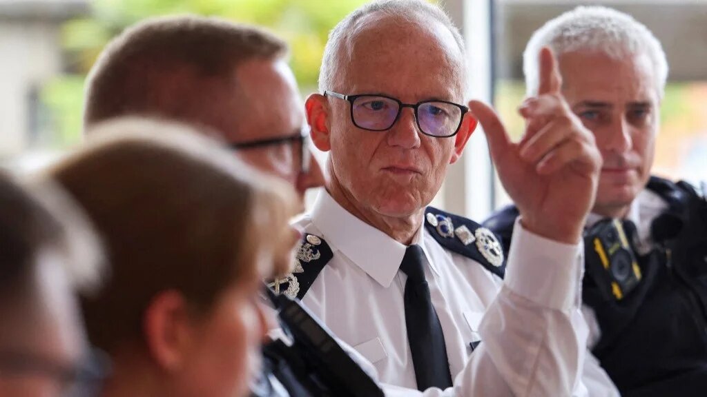 Metropolitan Police Commissioner Mark Rowley listens during a meeting with Territorial Support Group public order officers at Lambeth Police Headquarters in London on August 9, 2024 (AFP)