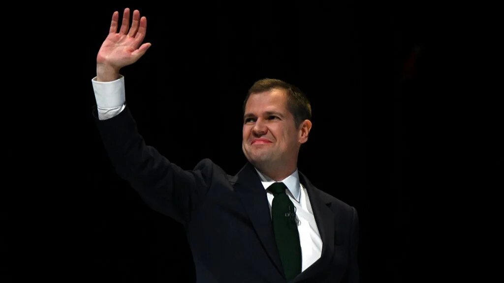 Robert Jenrick waves on the third day of the annual Conservative Party Conference in Birmingham, central England, on October 1, 2024 (AFP)