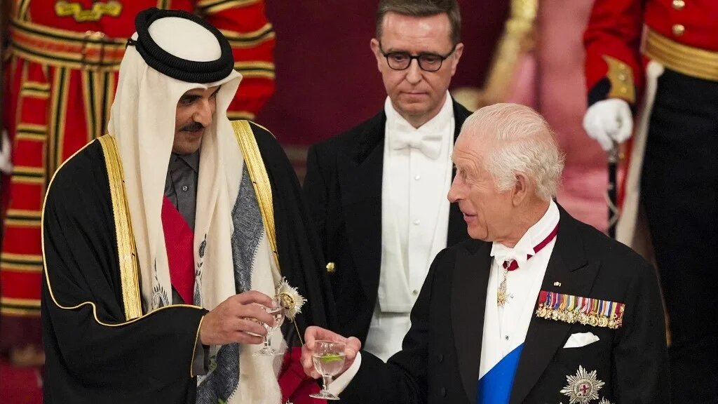 King Charles III and Emir Sheikh Tamim bin Hamad al-Thani during a State Banquet at Buckingham Palace in London on 3 December (AFP)