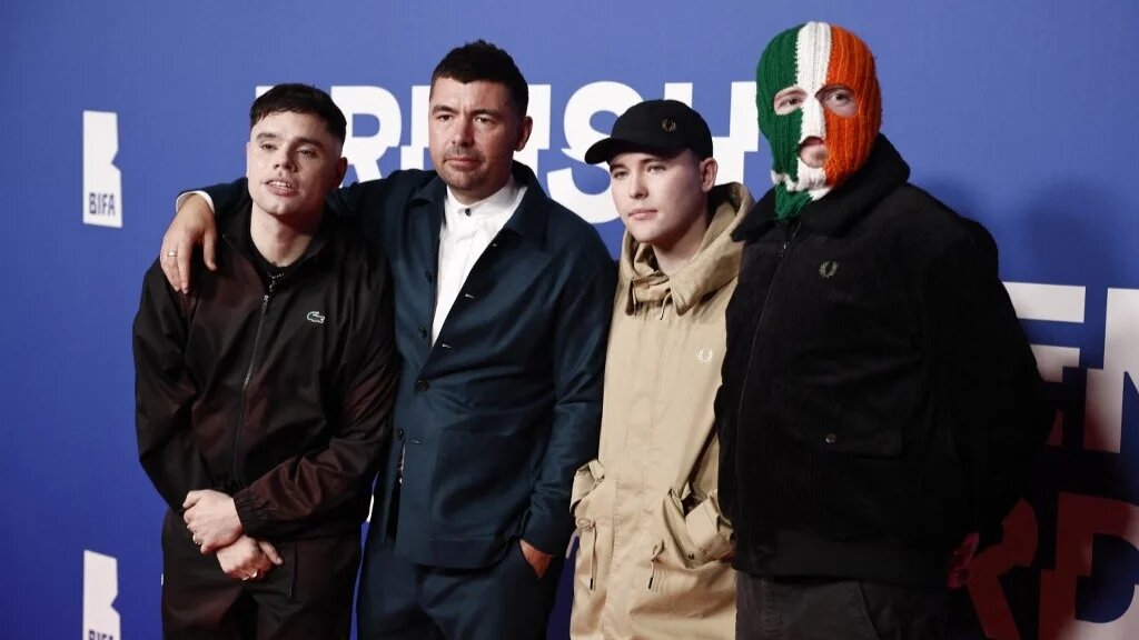 British movie director Rich Peppiatt (2nd L) poses with members of the Irish-language rap group Kneecap