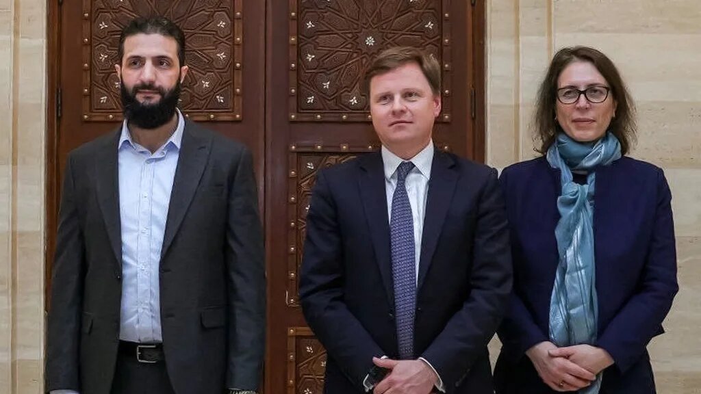 Abu Mohammed Jolani met Stephen Hickey, director of the Middle East department at Britain's Foreign Office and Ann Snow, the UK’s special representative for Syria (AFP)