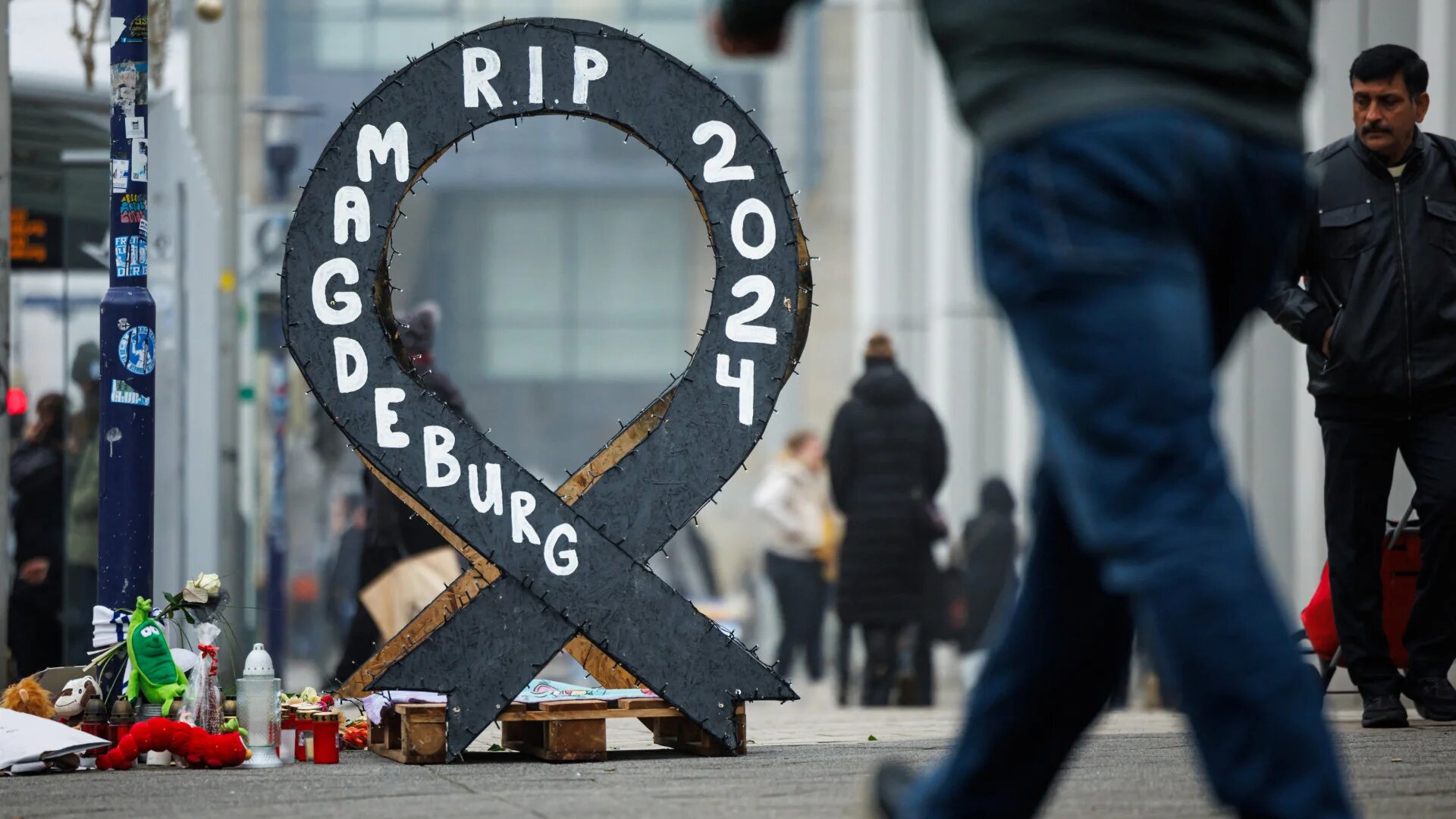 A makeshift memorial is pictured at the site of a car-ramming attack on a Christmas market in Magdeburg, eastern Germany, on 27 December 2024 (Jens Schlueter/AFP)