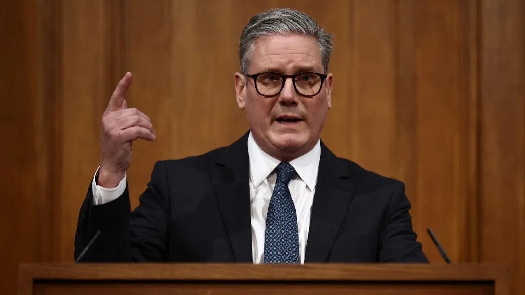 Britain's Prime Minister Keir Starmer gestures whilst speaking at a press conference at the Downing Street Briefing Room in central London on January 21, 2025 (AFP)