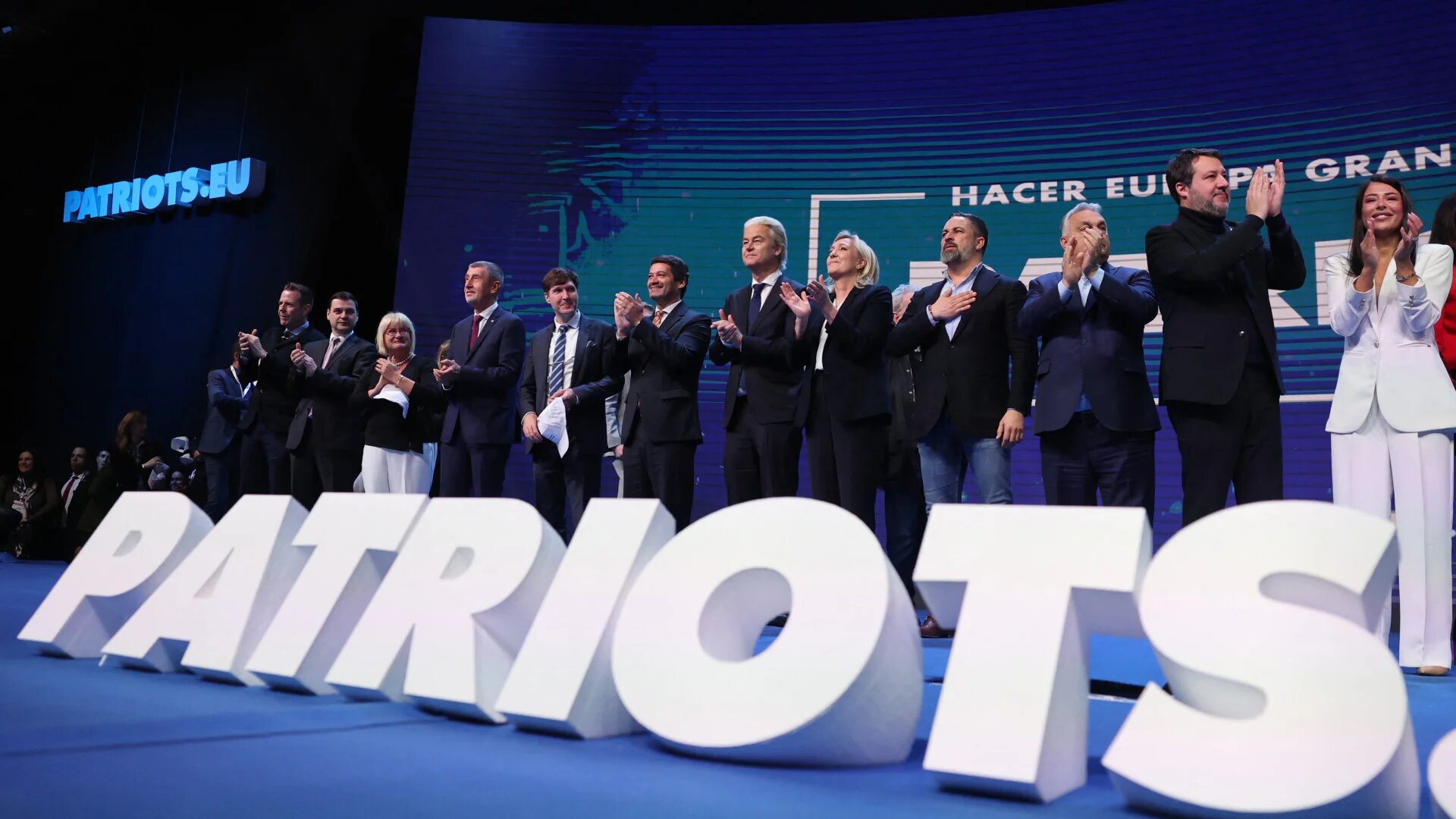 Participants onstage applaud as the Patriots for Europe, the European Parliament’s largest far-right bloc, concludes its meeting under the slogan “Make Europe Great Again” at a hotel in Madrid on 8 February 2025 (Thomas Coex/AFP)