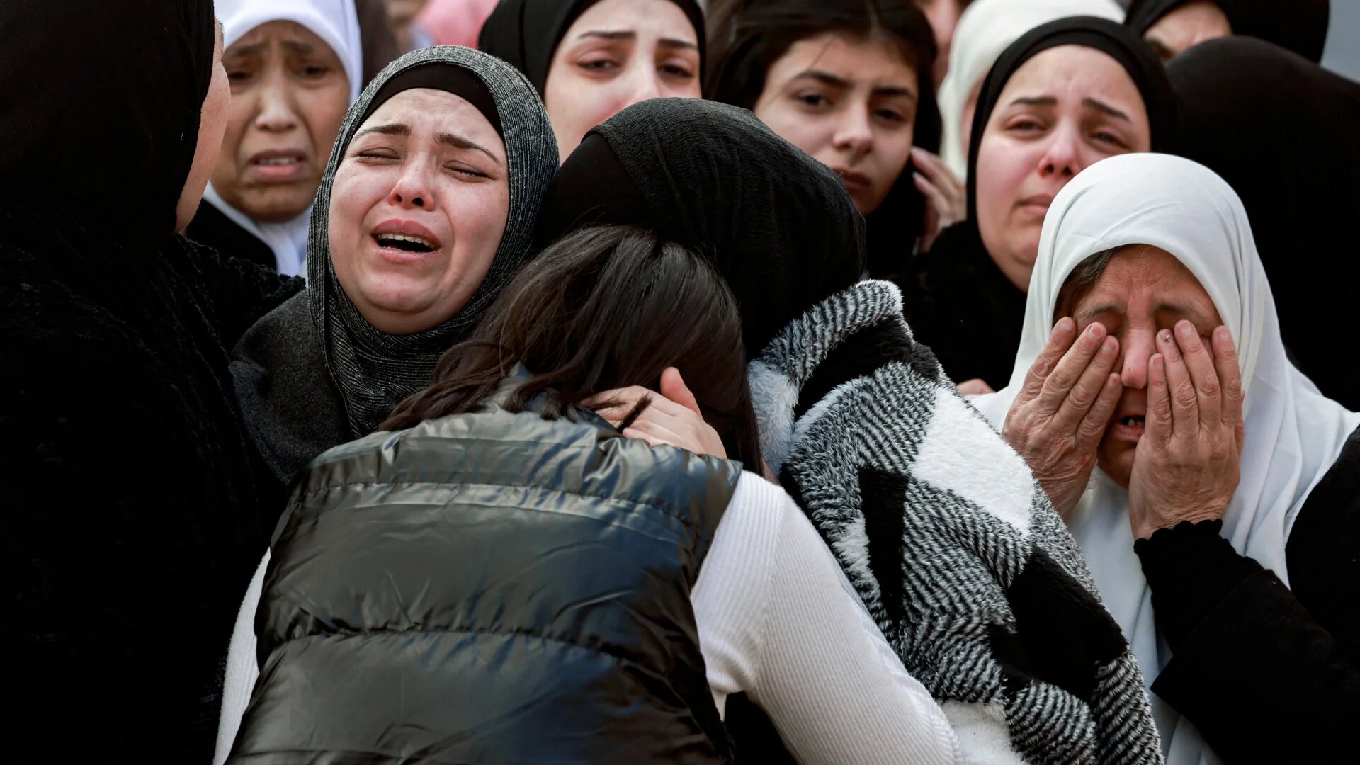 Relatives mourn the death of Palestinian Adel Bushkar, killed during an overnight Israeli military raid on the refugee camp of Askar east of Nablus in the occupied West Bank, during his funeral on 15 February 2025 (Jaafar Ashtiyeh/AFP)