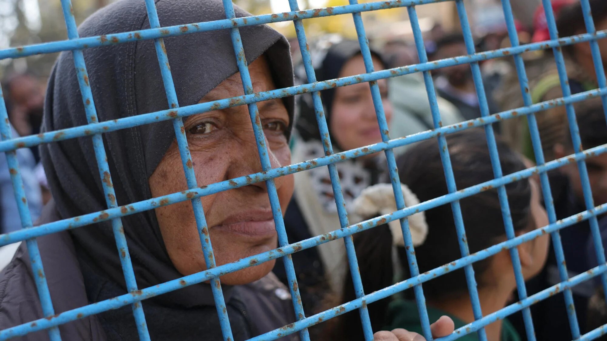 A relative of a freed Palestinian prisoner awaits their arrival at the European Hospital in Khan Yunis in the southern Gaza Strip on 15 February 2025 (AFP/Bashar Taleb)