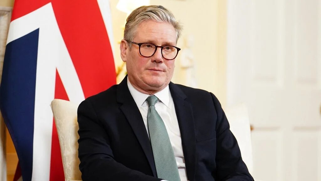 Prime Minister Keir Starmer listens as Canada's Prime Minister Mark Carney (unseen) speaks during a bilateral meeting inside 10 Downing Street, in central London, on 17 March 2025 (AFP)