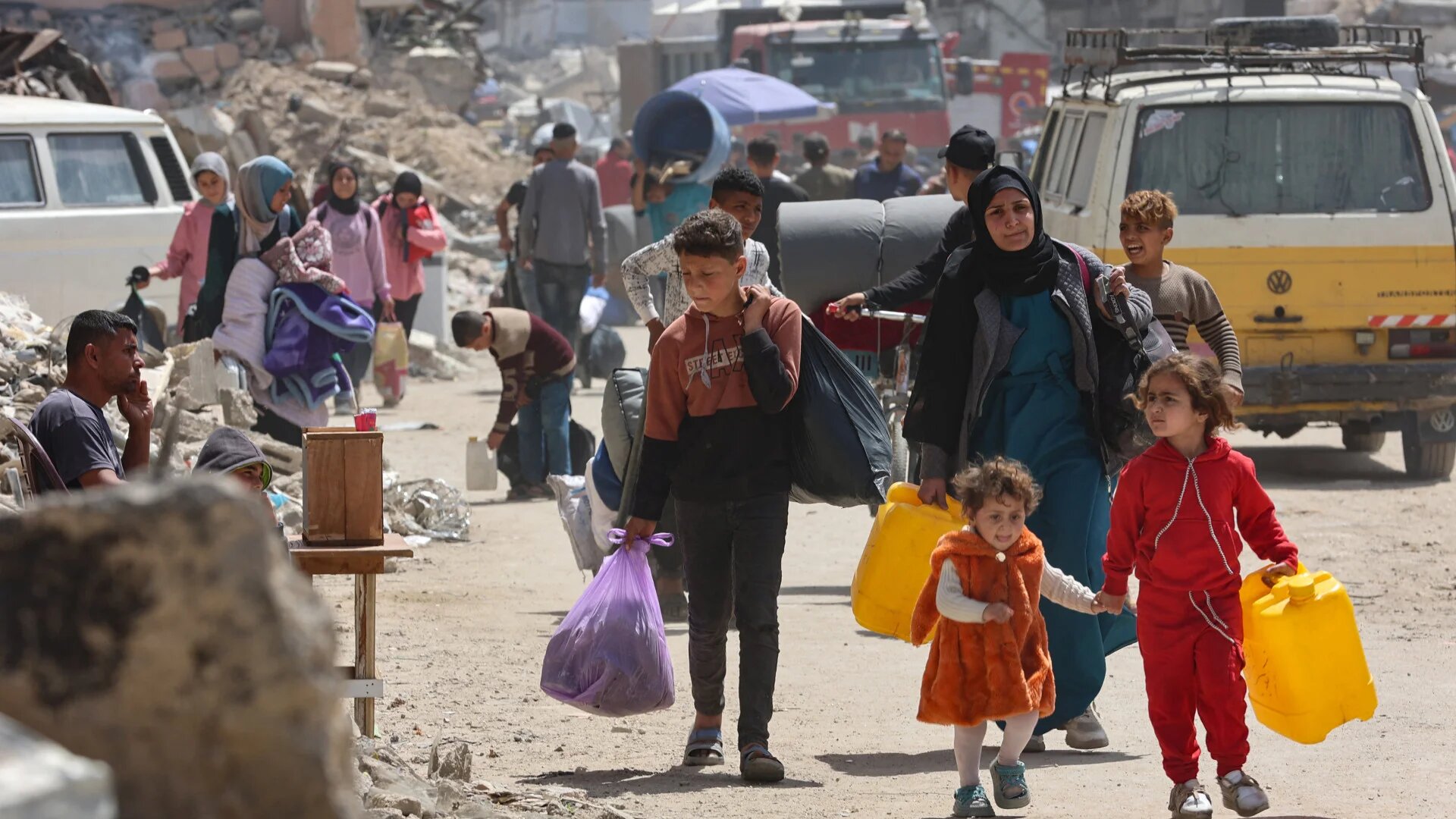 Palestinians transport their belongings as they flee Gaza City's eastern neighbourhood of Shujaiya following an evacuation order issued by the Israeli military on 3 April 2025 (Omar al-Qattaa/AFP)