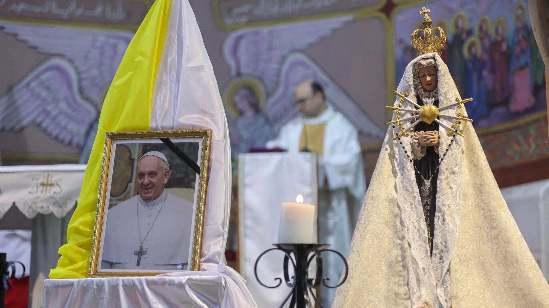 Palestinian mourners hold a mass for late Pope Francis at the Holy Family Church in Gaza City on 21 April 21 2025 (Omar al-Qattaa/AFP)